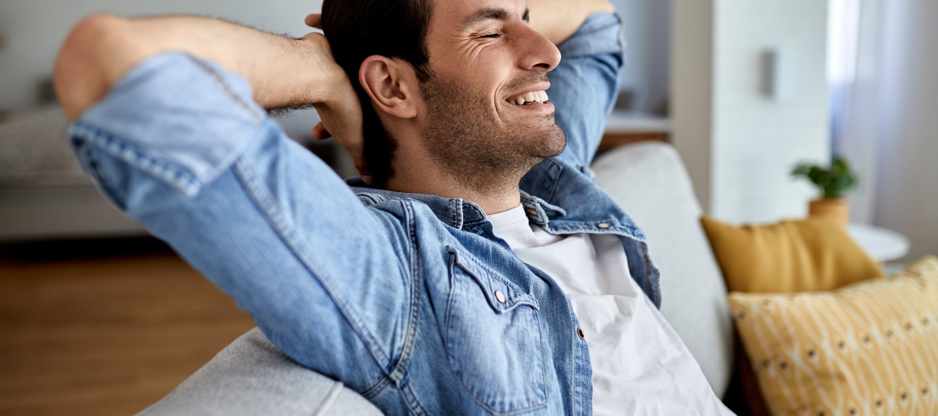 Senior couple enjoying time together on laptop indoors, smiling and relaxed.